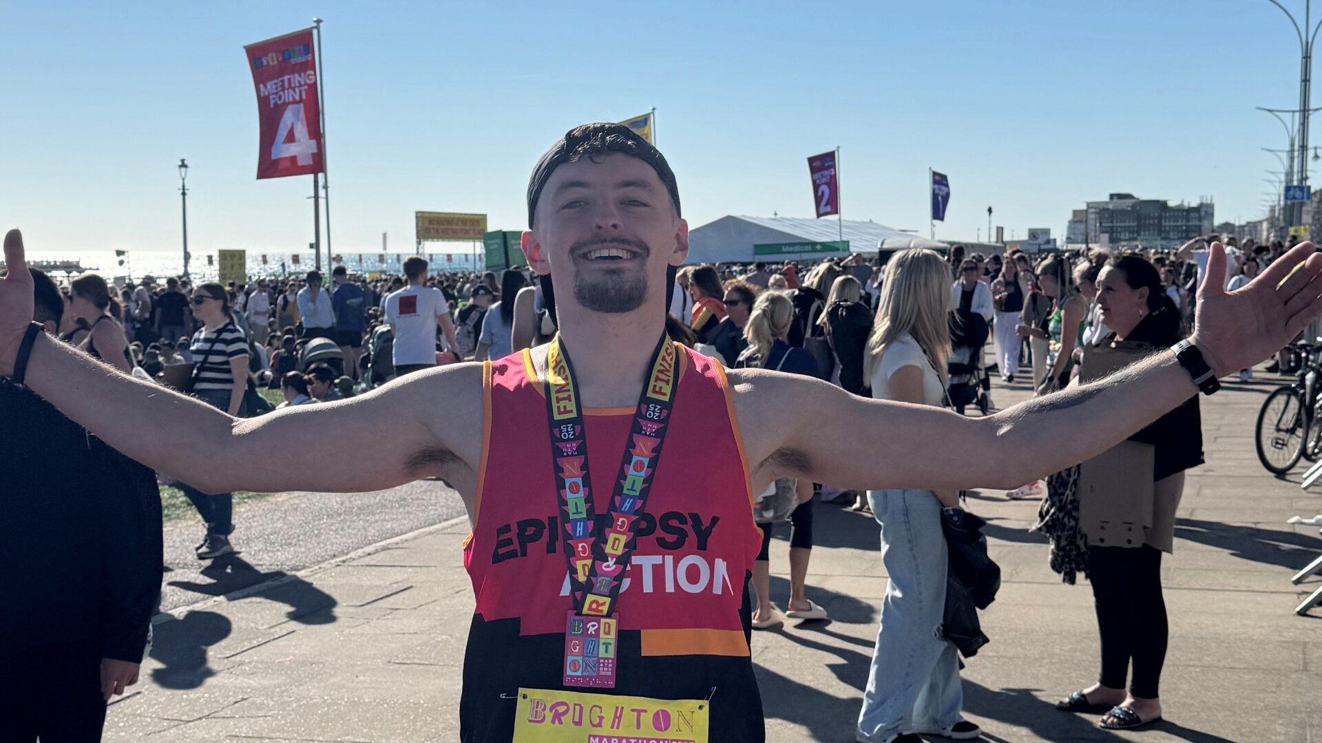 Epilepsy Action' runner finished Brighton Marathon 2025 at the seafront. Open up his arms and smiling happily. Epilepsy Action' runner finished Brighton Marathon 2025 at the seafront. Open up his arms and smiling happily.