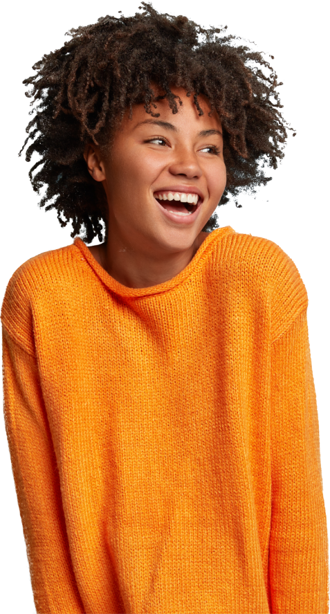 A smiling woman waring a orange jumper