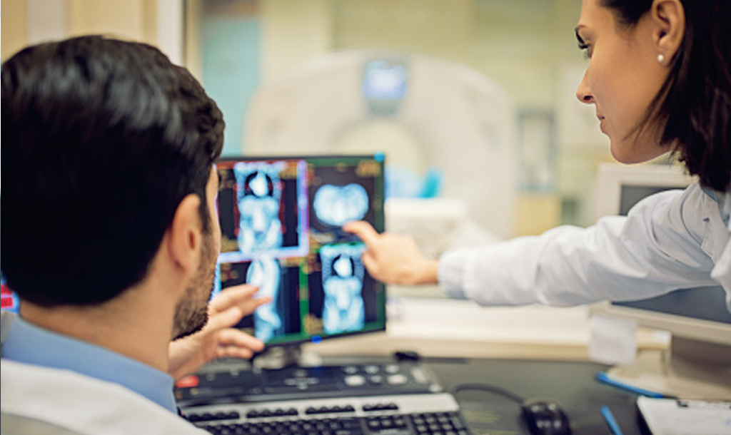 Two doctors studying MRI results.