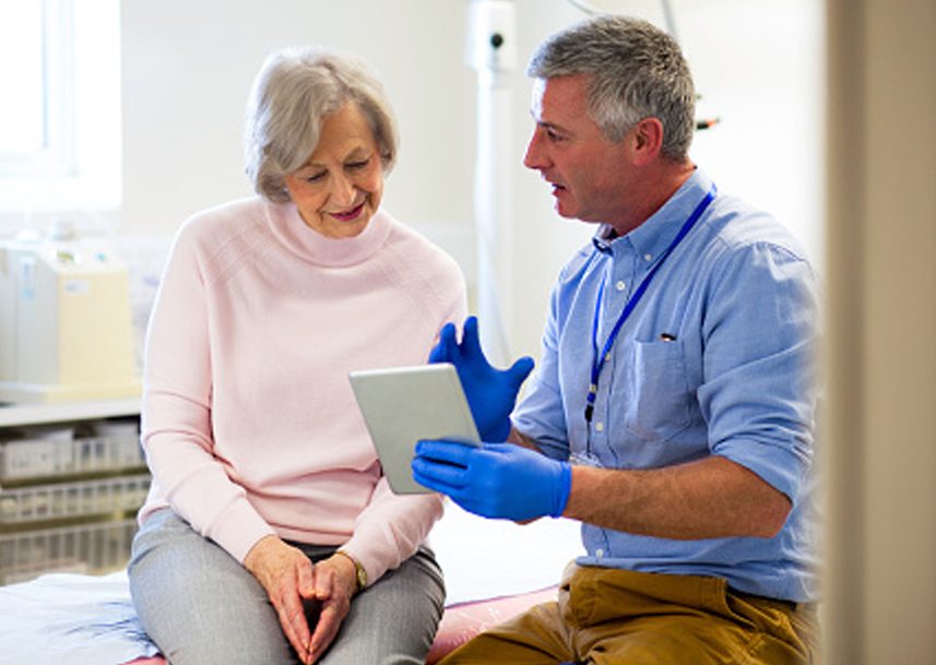 A doctor giving their patient a diagnosis