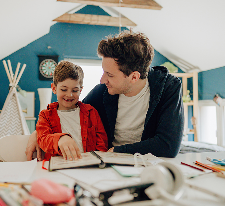 A father home-schooling their son