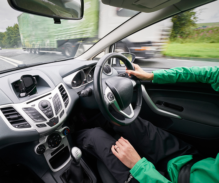 A driver sitting in their car.