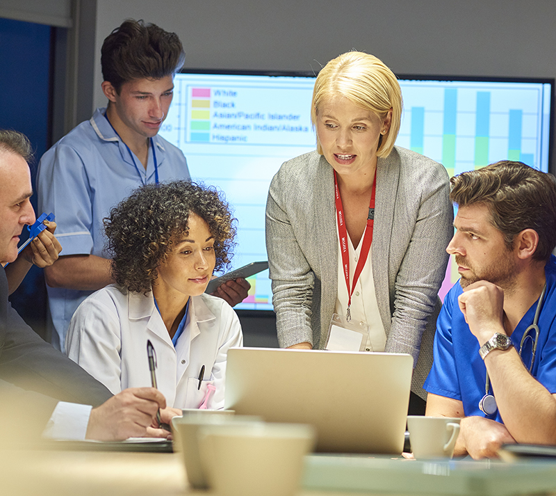 A group of business people meeting around a conference table