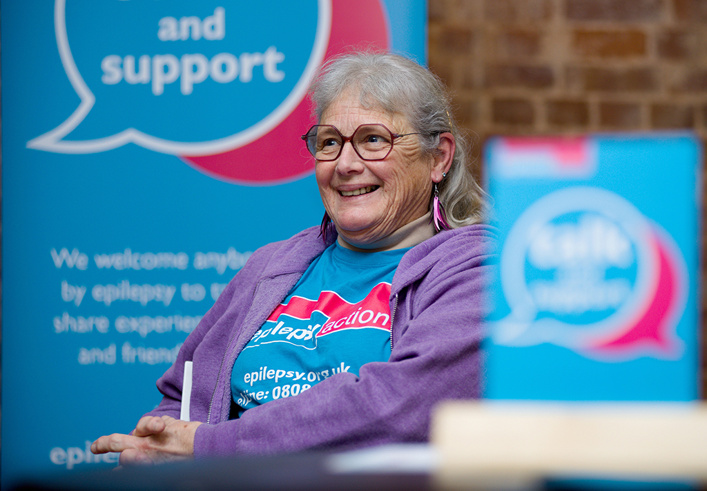 A older woman attending a talk and support event