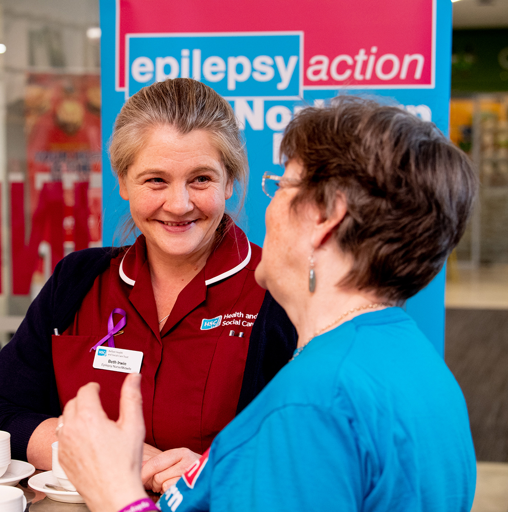 A health and social worker talking to a member of Epilepsy Action