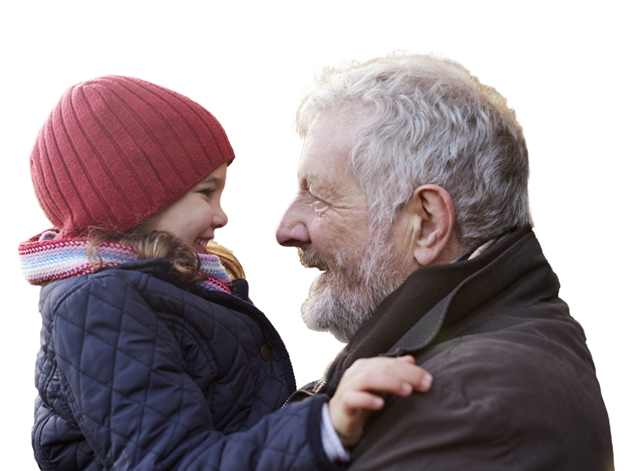 side view of a grandfather holding his granddaughter