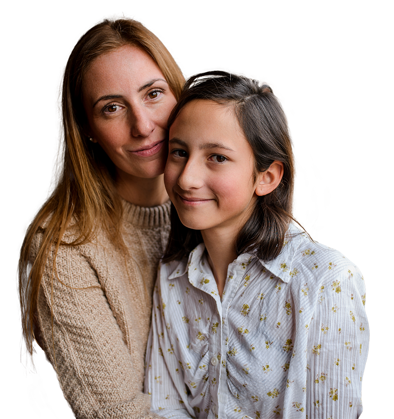 A mother and her daughter sitting close to each other