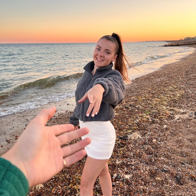 Image of Tahlya on a beach smiling, supporting her story that someone with epilepsy can improve their self-esteem