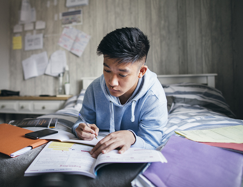 A young boy preparing for Exams