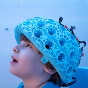 A child wearing the OPM MEG brain scanner