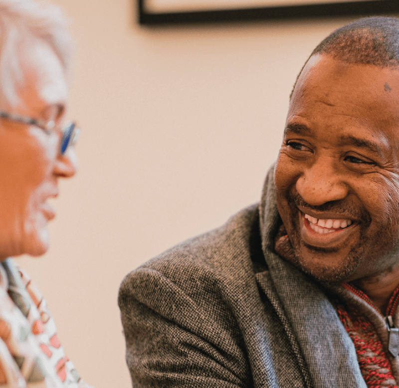 Man and woman talking and laughing together