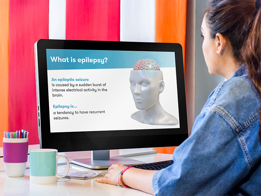 An employee completing an e-learning epilepsy training course on her computer. An employee completing an e-learning epilepsy training course on her computer.