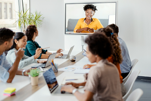 A group of colleagues watching a trainer deliver an epilepsy training course.