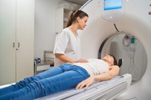 A radiographer talking to a patient about to have an MRI scan