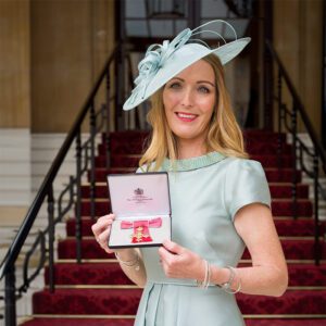 Paula McGowan receiving her OBE