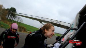 Emma getting on the plane