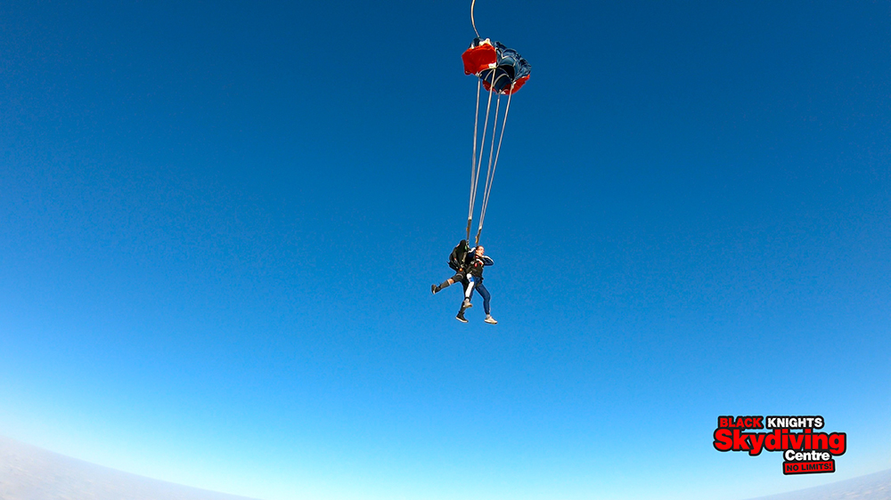 Emma and her instructor paragliding