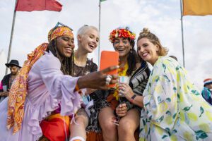 Four people enjoying a festival