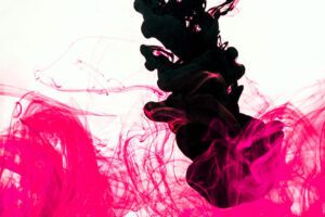 abstract image of pink and black ink flowing