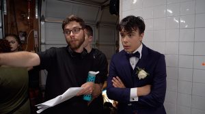 Director Miles speaking to actor Pearce about the scene