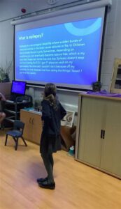 Maddison presenting on epilepsy at her school