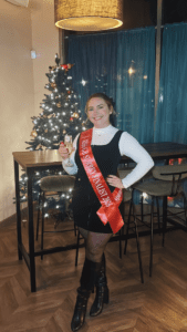 Emma dearling posing with a miss gb surrey sash