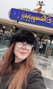 Beth taking a selfie outside disneyland paris