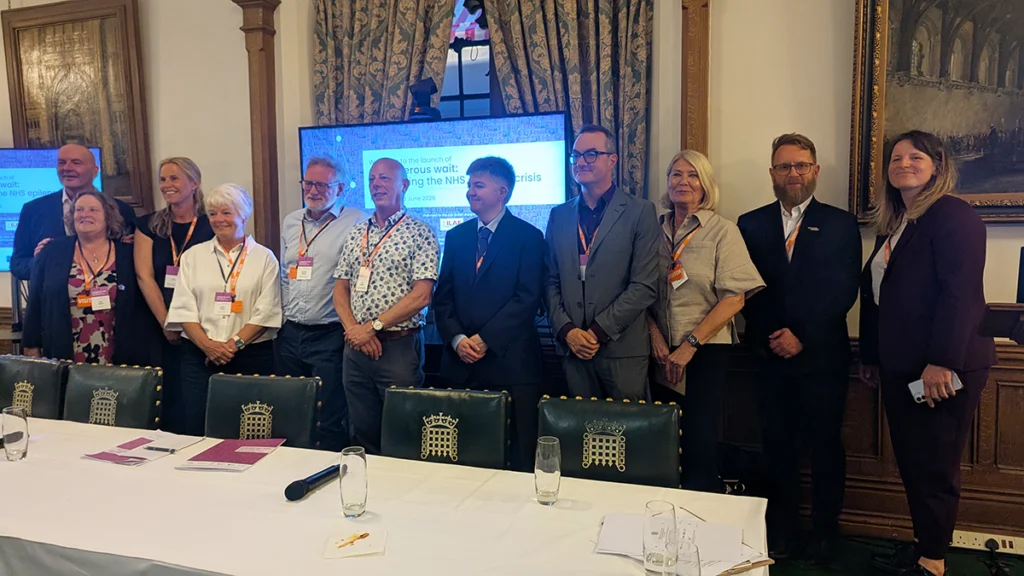 Parliamentary event raises discussion around long NHS waits and lack of access to epilepsy care in UK 1 Parliamentary event attendees stood in a line behind a panel table
