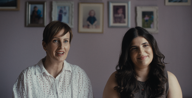 Portrait of mother and daughter at home