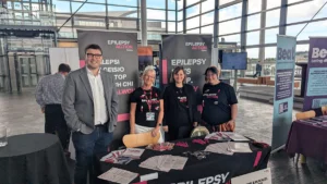 Four people stood at an Epilepsy Action stand at the Senedd. L-R: Chris Pate Epilepsy Action volunteer, Jan Paterson, Epilepsy Action Wales manager, Helen Ross, consulting for Epilepsy Action and Becci Smart, Epilepsy Action volunteer.
