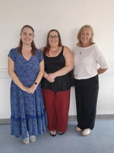 Three women - abbie, elizabeth and jo, smiling.