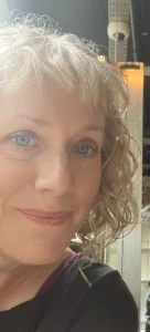 A close up of jo glenton's face smiling