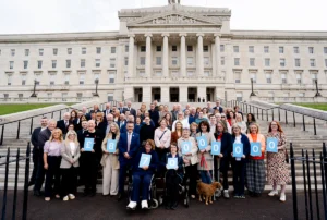 Ninca group outside the stormont building delivering the report calling for neurology reforms in northern ireland
